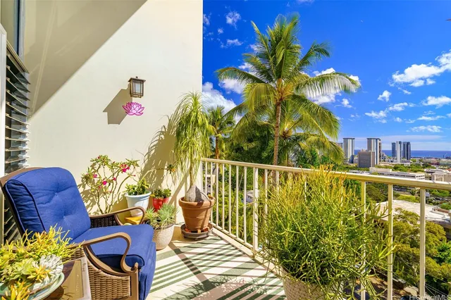 a view of two chairs in a balcony