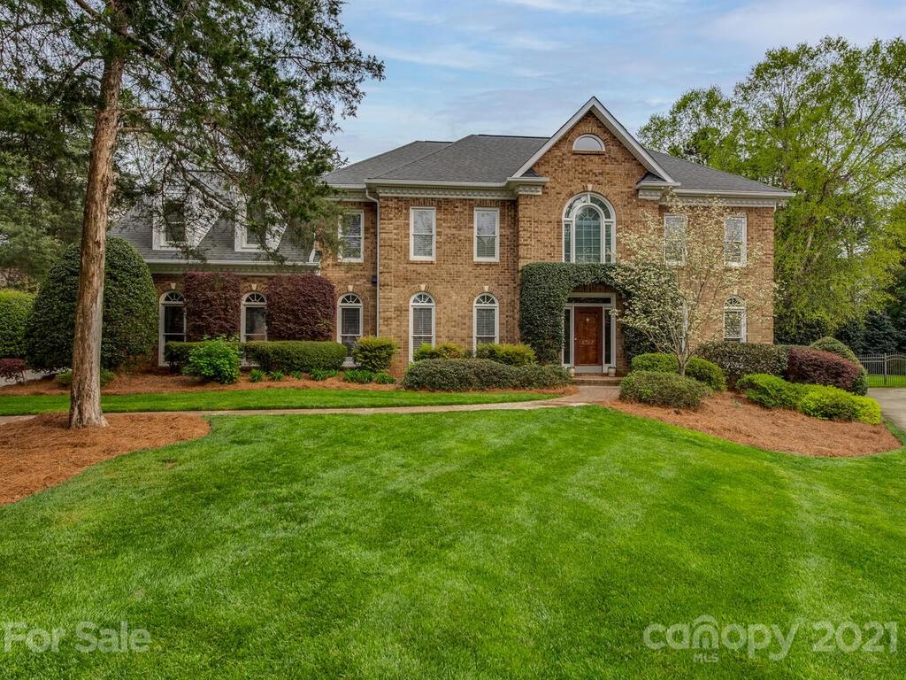4743 Binfords Ridge Road Charlotte, NC 28226 - Photo 1 of 41 a front view of a house with a yard and green space
