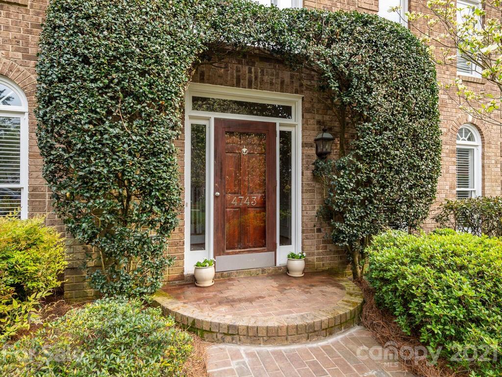4743 Binfords Ridge Road Charlotte, NC 28226 - Photo 2 of 41 a view of a brick house with potted plants