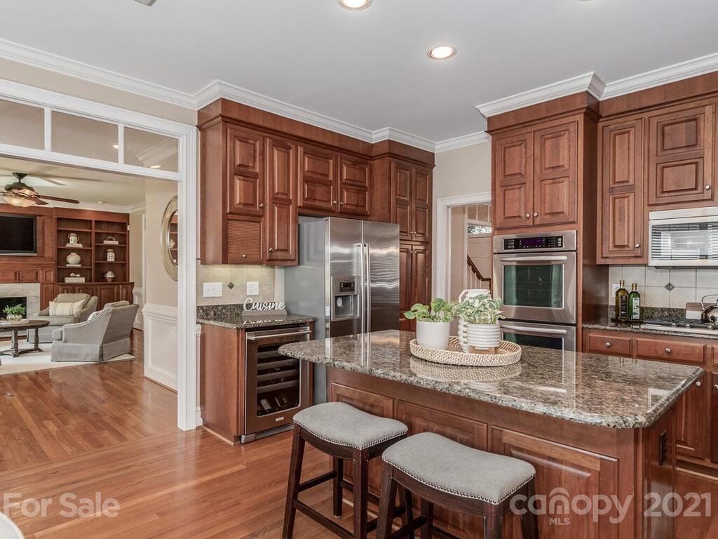 4743 Binfords Ridge Road Charlotte, NC 28226 - Photo 11 of 41 a kitchen with a stove a sink and a refrigerator