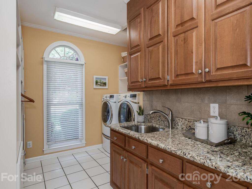 4743 Binfords Ridge Road Charlotte, NC 28226 - Photo 15 of 41 a kitchen with granite countertop stainless steel appliances a sink and cabinets