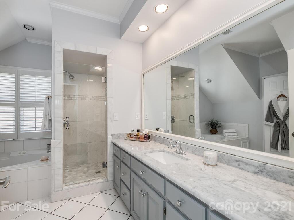 4743 Binfords Ridge Road Charlotte, NC 28226 - Photo 18 of 41 a bathroom with a granite countertop sink mirror and double