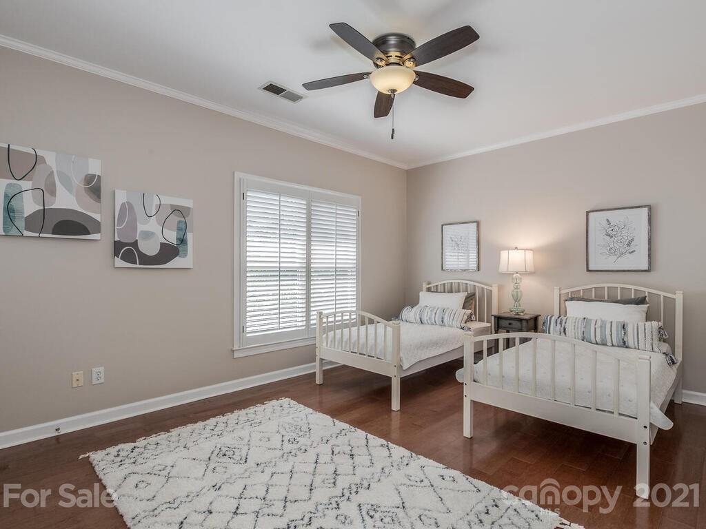 4743 Binfords Ridge Road Charlotte, NC 28226 - Photo 25 of 41 a bedroom with furniture and a window