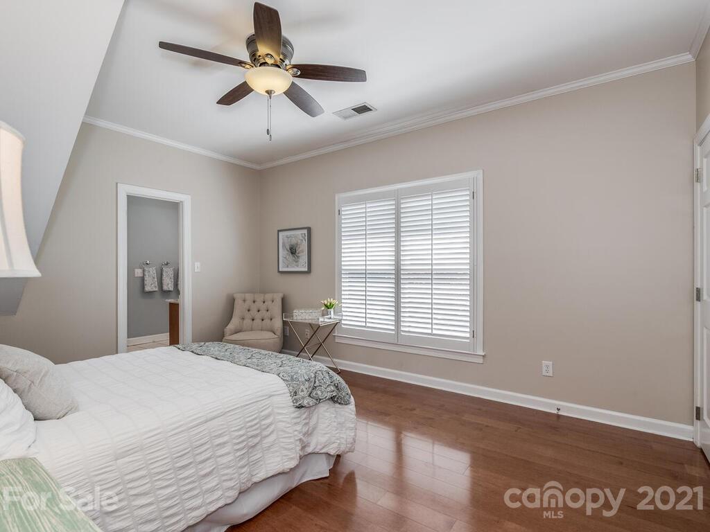 4743 Binfords Ridge Road Charlotte, NC 28226 - Photo 26 of 41 a bedroom with a bed and a window