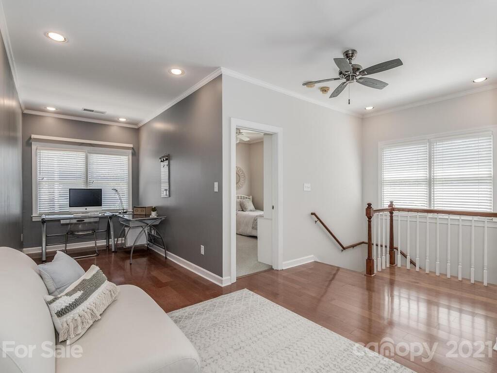 4743 Binfords Ridge Road Charlotte, NC 28226 - Photo 29 of 41 a living room with furniture and a wooden floor