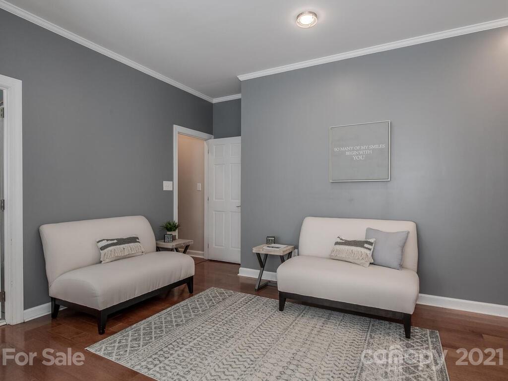 4743 Binfords Ridge Road Charlotte, NC 28226 - Photo 30 of 41 a living room with furniture and a rug