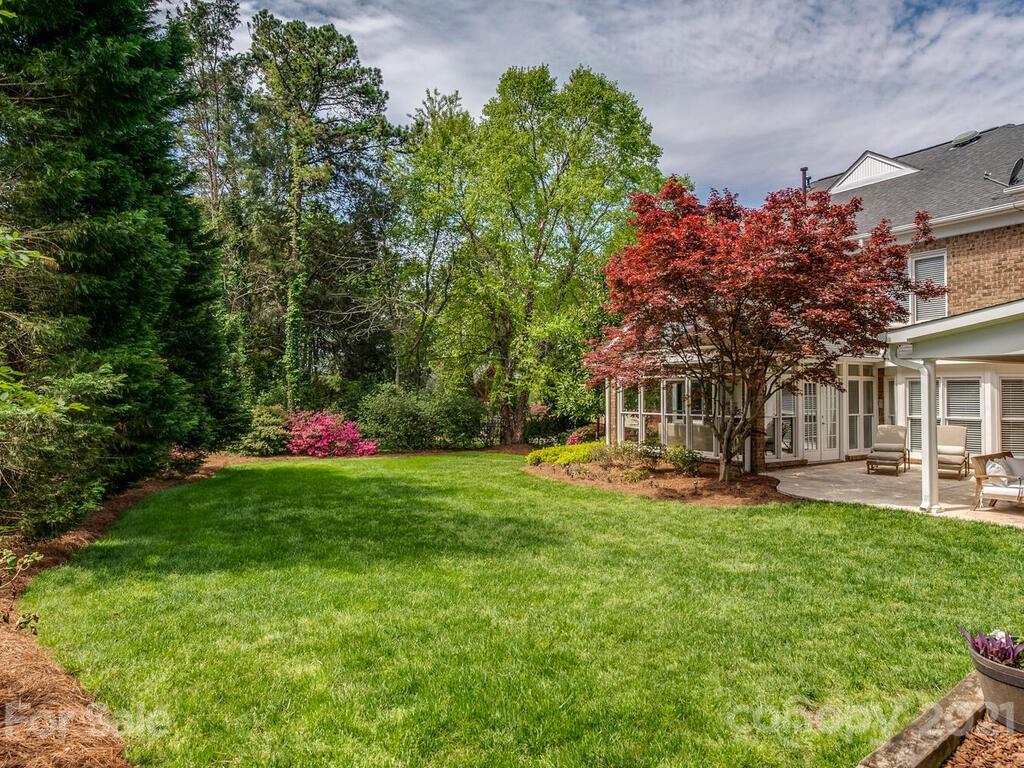 4743 Binfords Ridge Road Charlotte, NC 28226 - Photo 37 of 41 a front view of a house with a yard and fountain