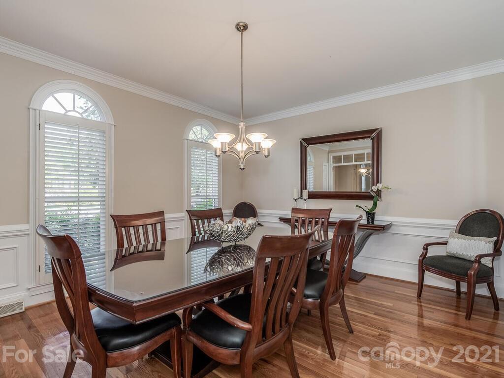 4743 Binfords Ridge Road Charlotte, NC 28226 - Photo 6 of 41 a view of a dining room with furniture window and wooden floor