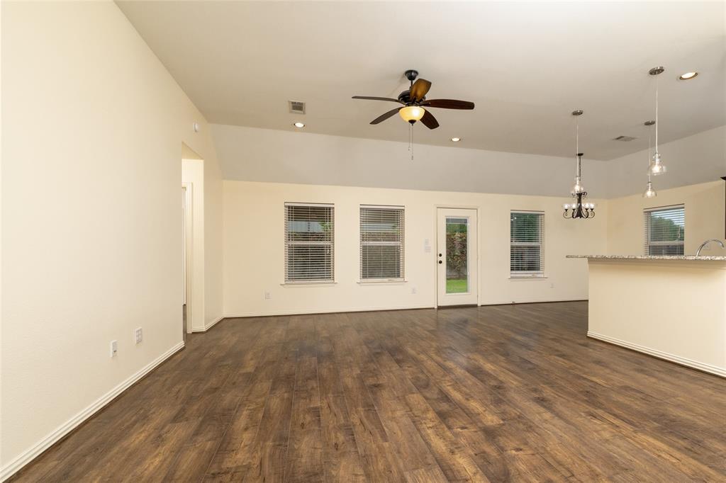 405 Kimbrough Road Azle, TX 76020 - Photo 4 of 39 a view of an empty room with wooden floor and a window