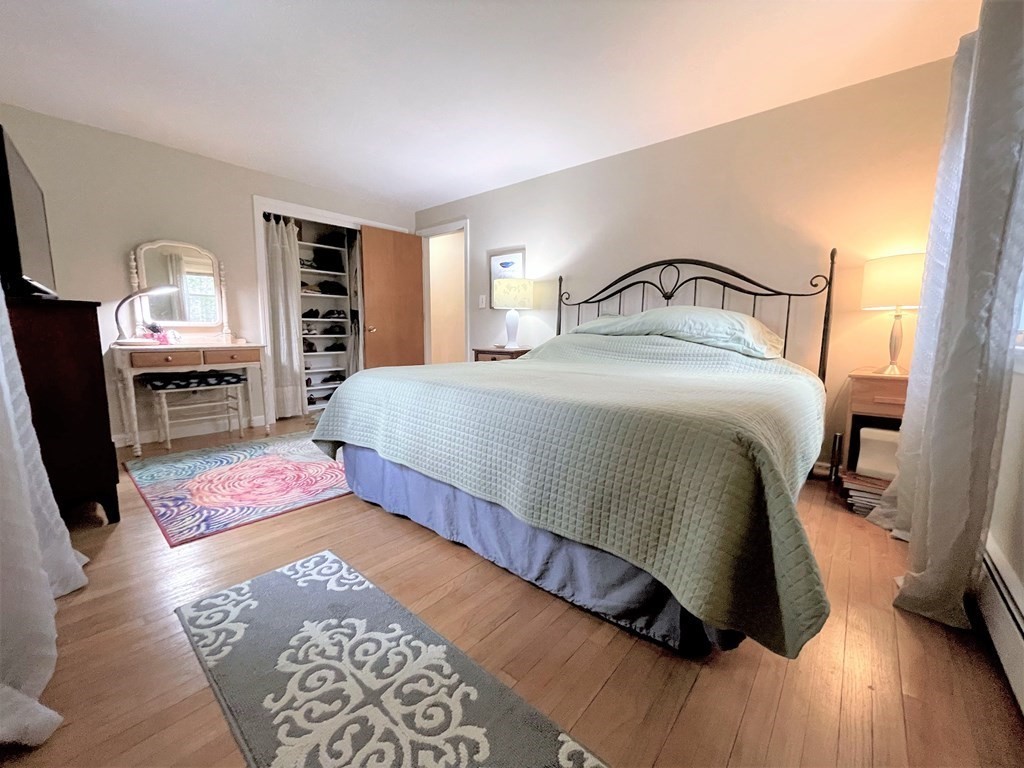 10 Phyllis Road Foxboro, MA 02035 - Photo 16 of 28 a bedroom with bed and wooden floor