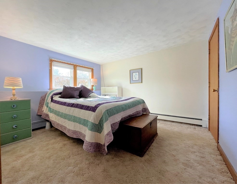 10 Phyllis Road Foxboro, MA 02035 - Photo 20 of 28 a bedroom with a bed and window