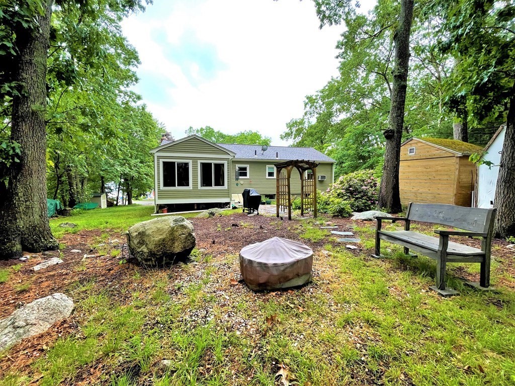 10 Phyllis Road Foxboro, MA 02035 - Photo 26 of 28 a view of a house with backyard sitting area and garden