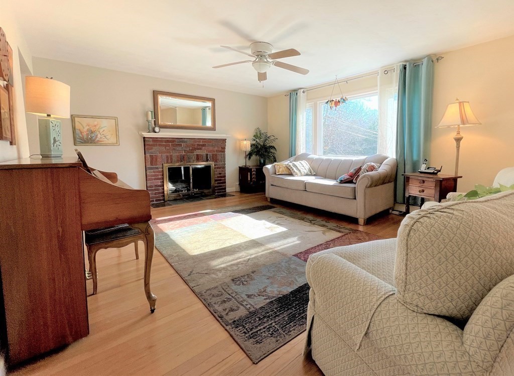 10 Phyllis Road Foxboro, MA 02035 - Photo 4 of 28 a living room with furniture and a fireplace