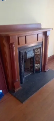 a room with wooden floor and a window