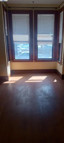 a view of an empty room with a wooden door