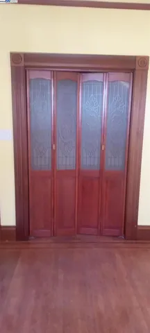 a view of a livingroom with wooden floor