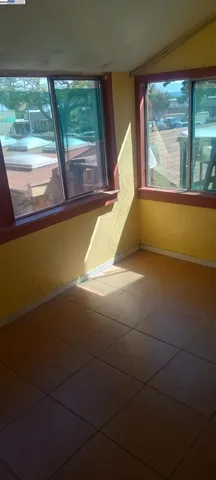 a kitchen with granite countertop white cabinets and stainless steel appliances