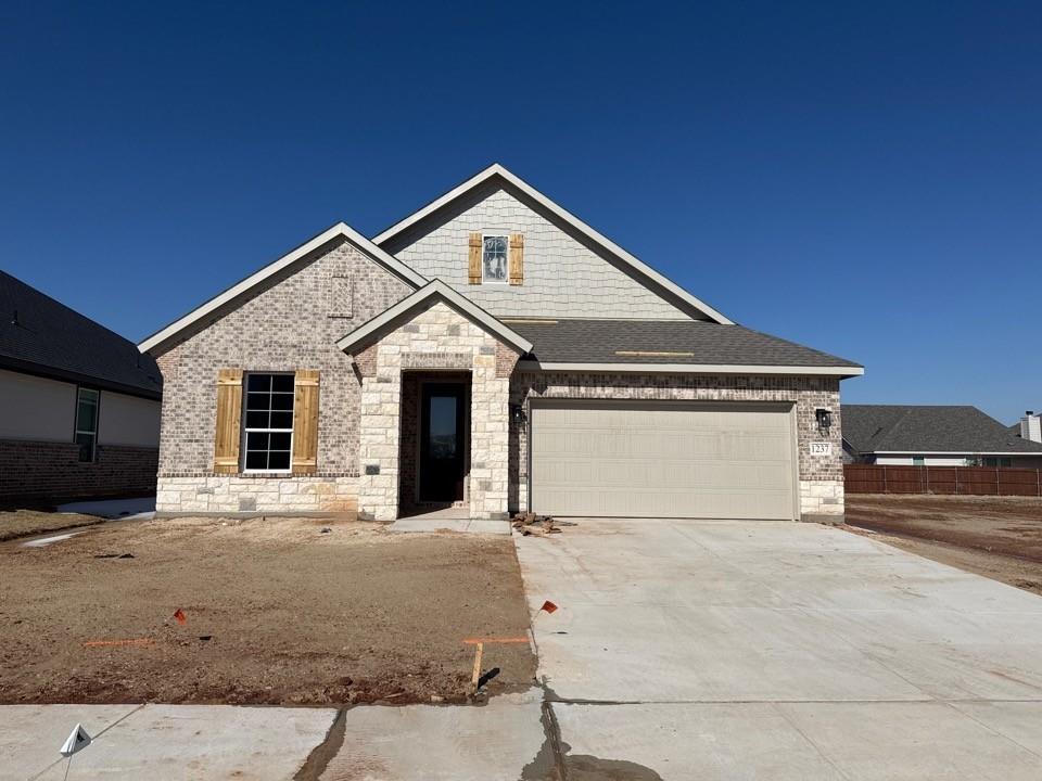a view of garage and front door