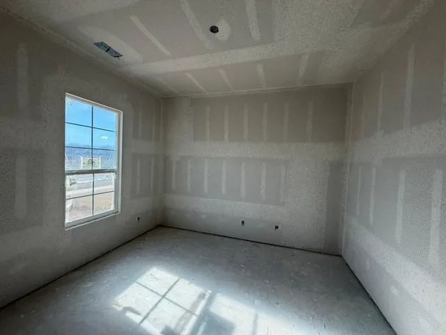 an empty room with windows
