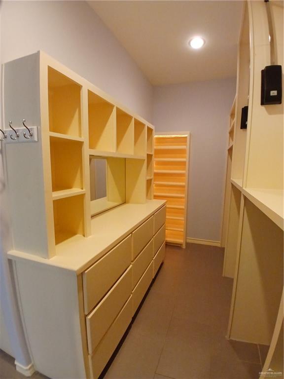 2423 West Hampton Avenue Edinburg, TX 78539 - Photo 7 of 15 a storage room with wooden floor