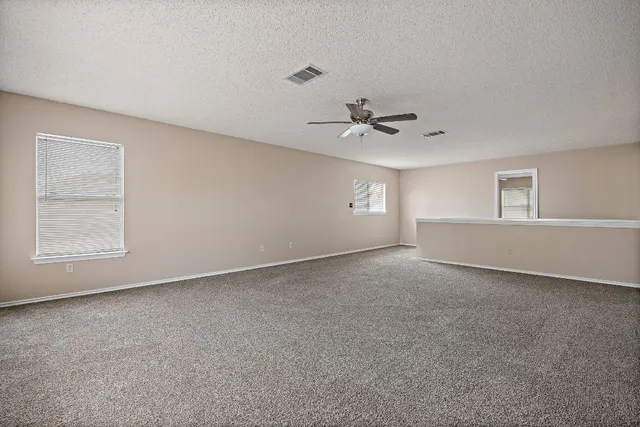 a view of balcony with wooden floor and fence