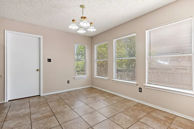 a kitchen with stainless steel appliances granite countertop a stove sink and cabinets