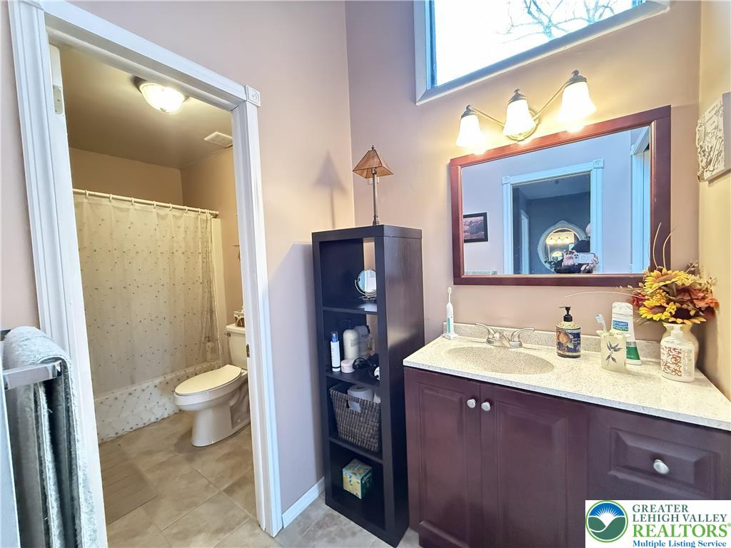 5933 Decker Road Bushkill, PA 18324 - Photo 14 of 51 a bathroom with a sink vanity and a toilet