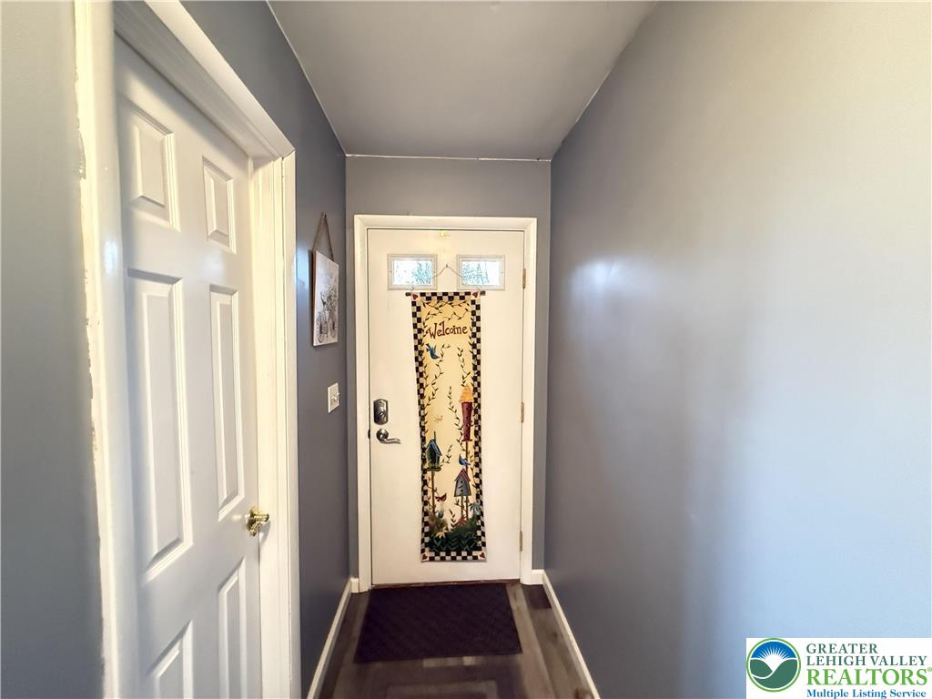 5933 Decker Road Bushkill, PA 18324 - Photo 24 of 51 a view of a hallway with wooden floor and windows