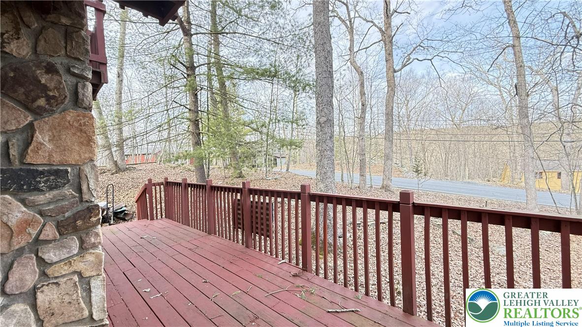5933 Decker Road Bushkill, PA 18324 - Photo 26 of 51 a balcony with wooden floor and fence