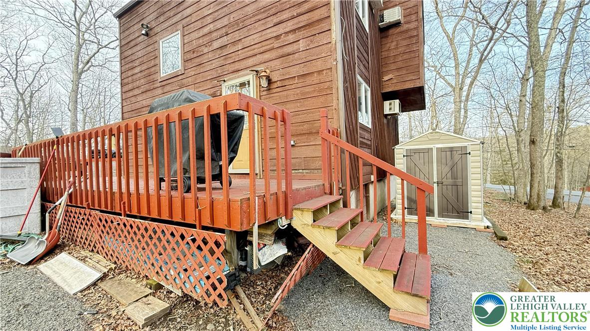 5933 Decker Road Bushkill, PA 18324 - Photo 27 of 51 a view of entryway with wooden stairs