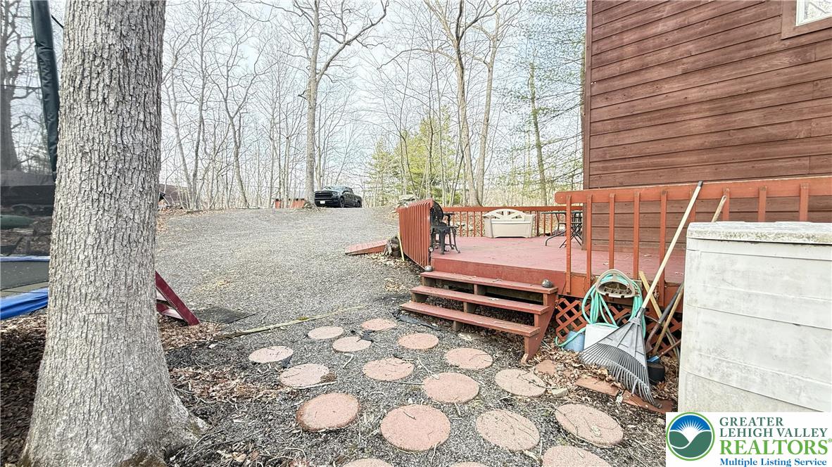 5933 Decker Road Bushkill, PA 18324 - Photo 29 of 51 a outdoor space with a couch and large trees