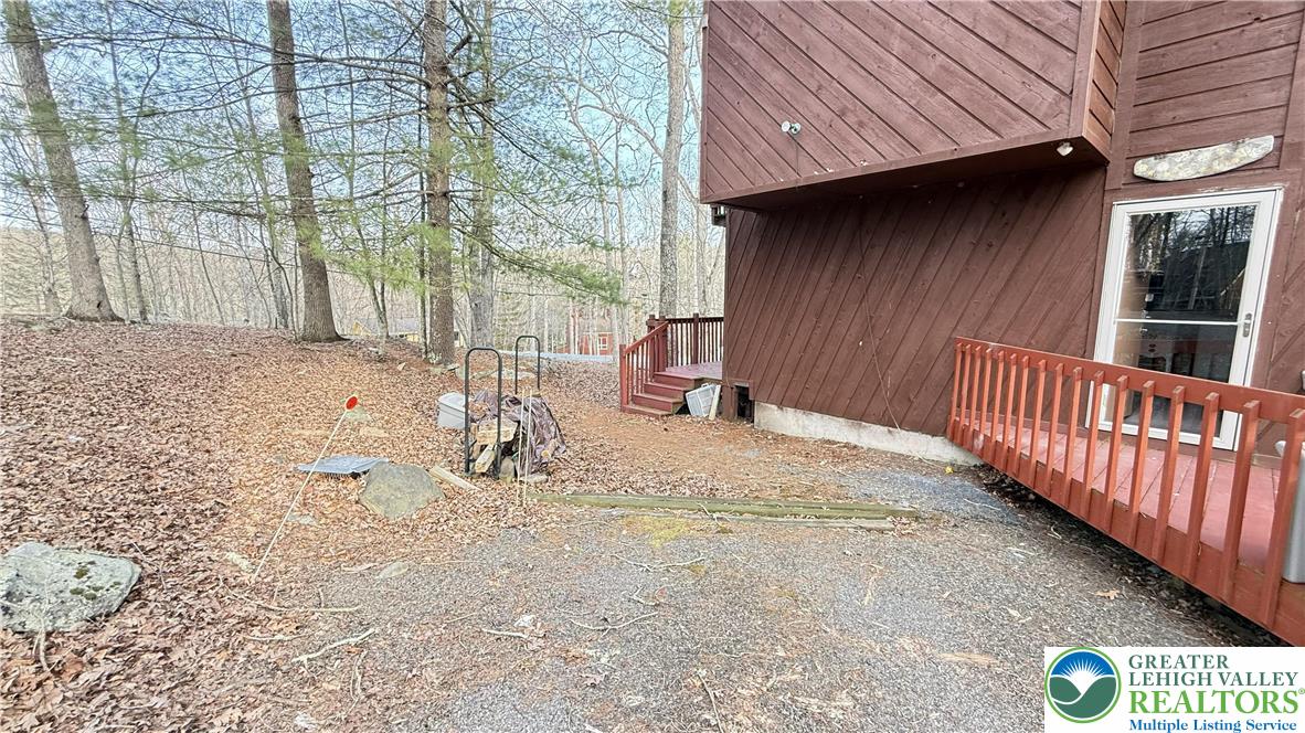 5933 Decker Road Bushkill, PA 18324 - Photo 30 of 51 a view of a backyard with a tree