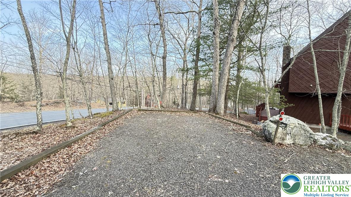 5933 Decker Road Bushkill, PA 18324 - Photo 31 of 51 a view of a backyard with large trees