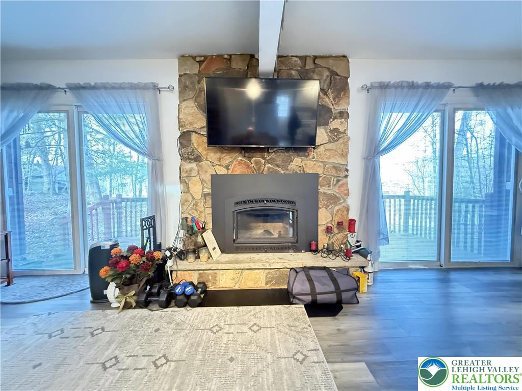 5933 Decker Road Bushkill, PA 18324 - Photo 7 of 51 a living room with furniture and a flat screen tv