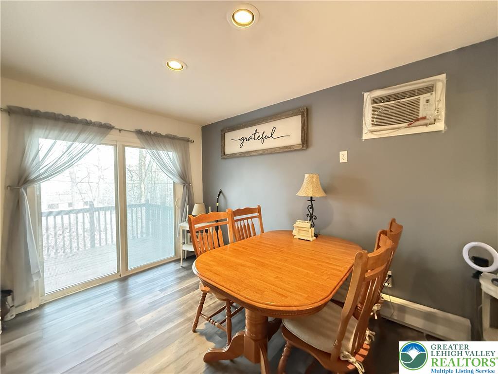 5933 Decker Road Bushkill, PA 18324 - Photo 9 of 51 a view of a dining room with furniture and wooden floor
