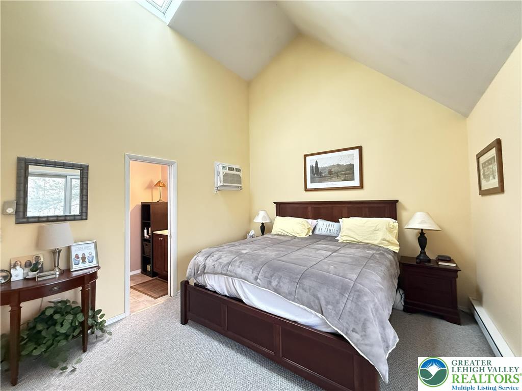 5933 Decker Road Bushkill, PA 18324 - Photo 10 of 51 a bedroom with a bed and wooden floor
