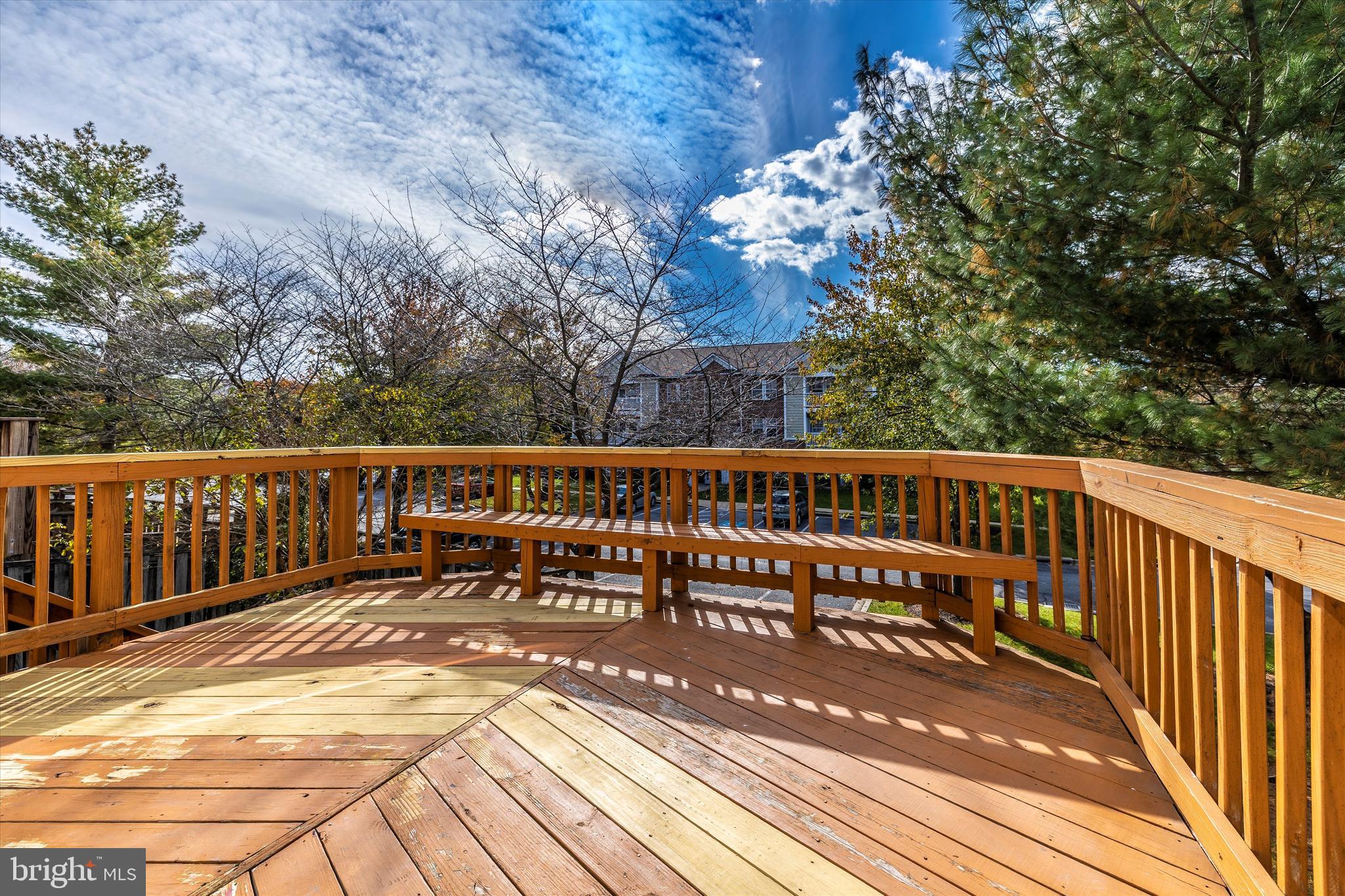 8001 Hollow Reed Court Frederick, MD 21701 - Photo 4 of 33 a view of a balcony with wooden chairs