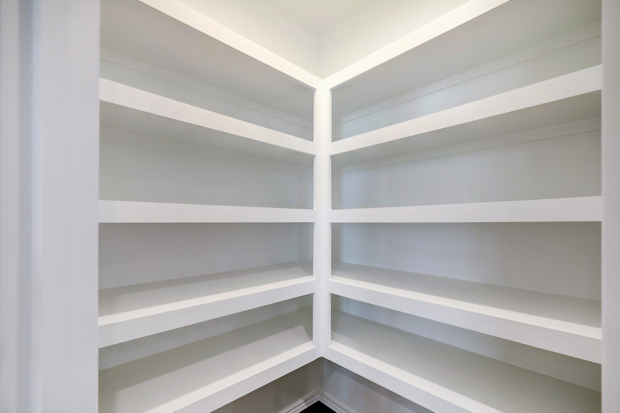 5314 Castlebury Meadows Dr Spring Spring, TX 77373 - Photo 11 of 19 Large walk-in pantry with built-in shelving—perfect for keeping kitchen essentials organized and easily accessible.