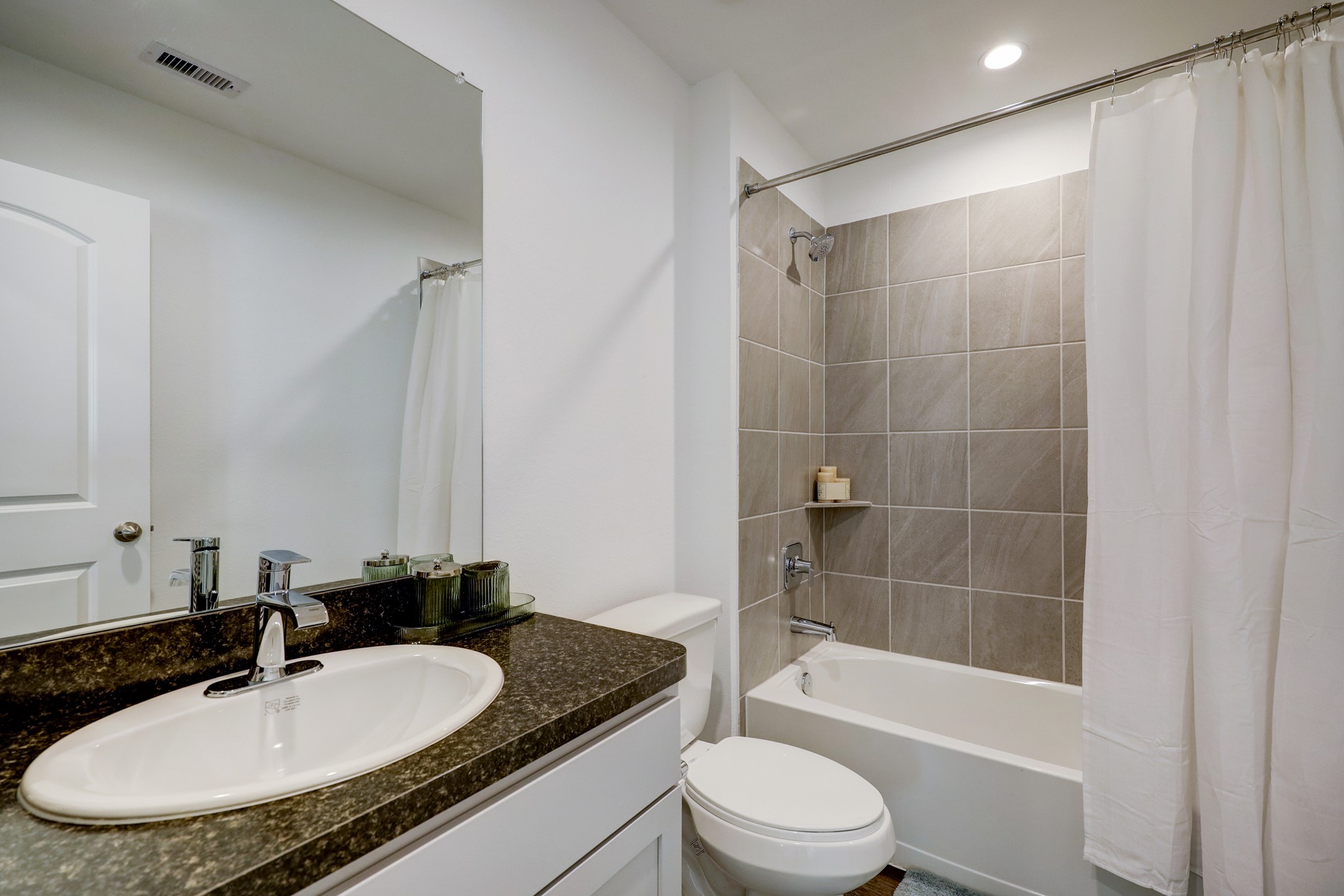 5314 Castlebury Meadows Dr Spring Spring, TX 77373 - Photo 15 of 19 Well-appointed full bathroom showcasing a clean, modern design, complete with a tub/shower combination and a stylish vanity.