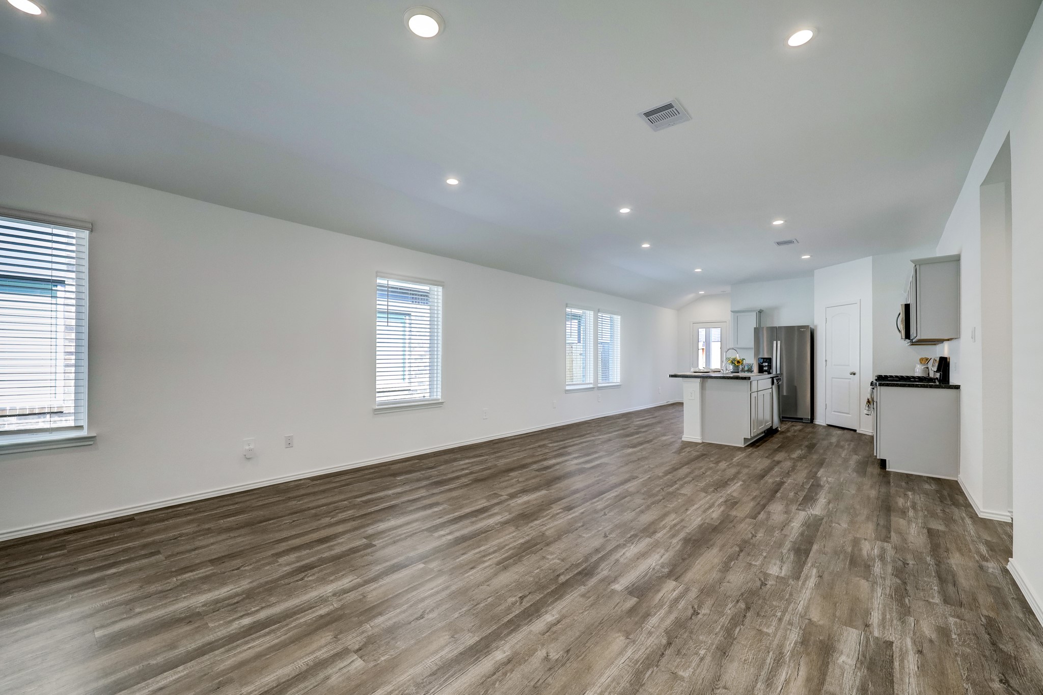 5314 Castlebury Meadows Dr Spring Spring, TX 77373 - Photo 8 of 19 Expansive open living space with wood-look flooring, recessed lighting, and a layout perfect for both relaxing and entertaining.