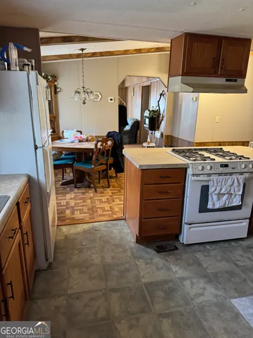 a view of living room with furniture and a window