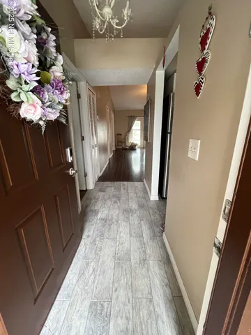 a view of a hallway view with wooden floor