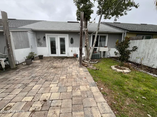 a view of a front door of a house with a yard