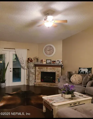 a living room with furniture and a fireplace