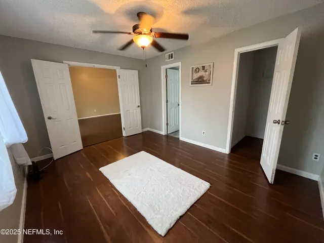 wooden floor in a hall with an entryway