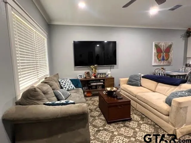 a living room with furniture and a table
