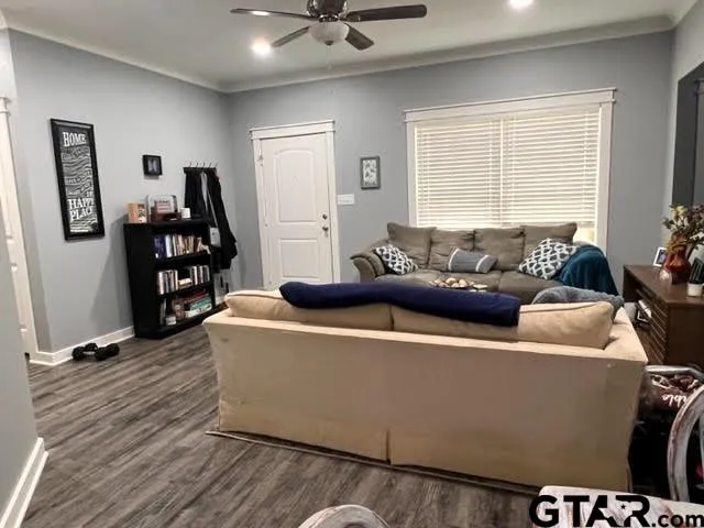 a kitchen with sink a refrigerator and cabinets