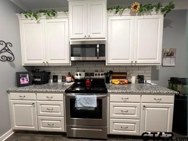 a bathroom with a sink toilet and mirror