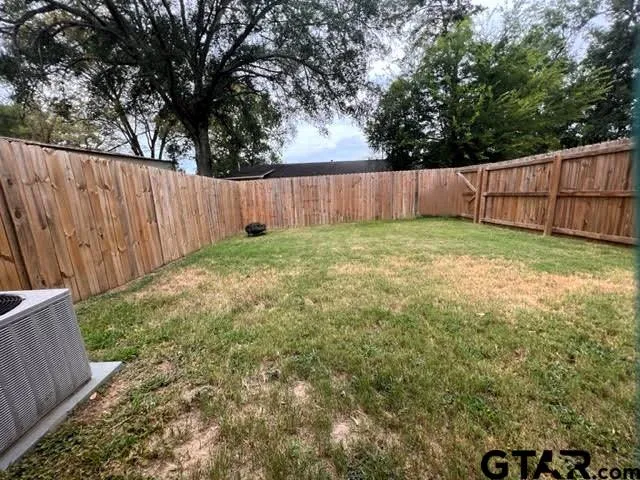 a view of kitchen with refrigerator microwave and cabinets
