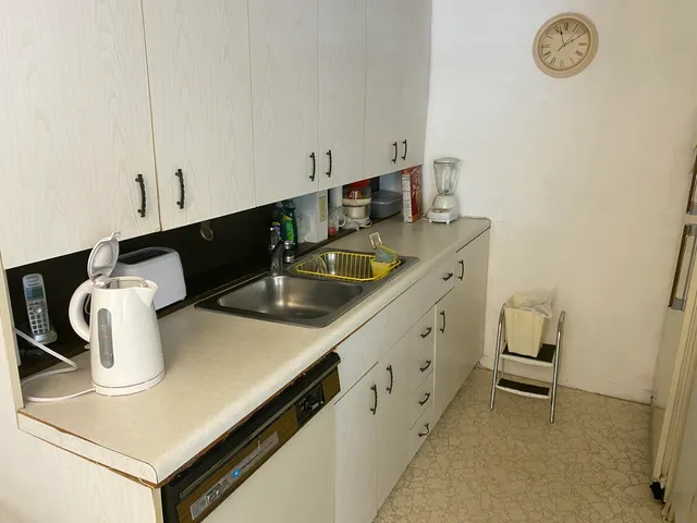 a kitchen with a sink and a stove